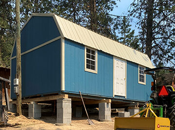 Blue barn house on stilts